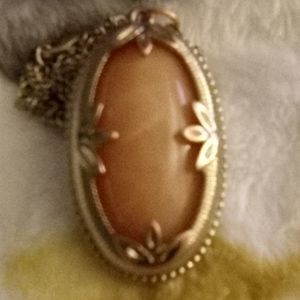 Antique necklace with gold surrounding stone